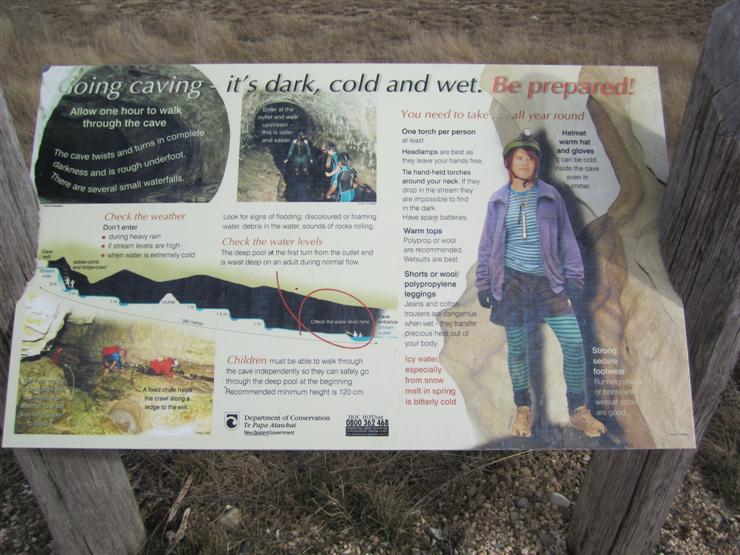 Warning/Advice sign at Cave Stream at Arthur's Pass - people can walk and crawl, chest deep in water through a cave through which a glacial stream runs. Brrrr.