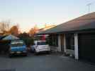 Steve and Yvonne's vehicles and the front of the bungalow