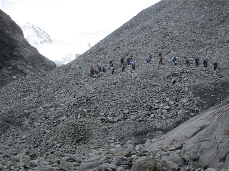 The group ahead of ours start up the moraine with their newly fitted crampons