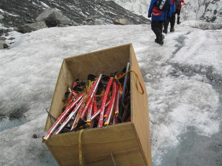 "Ah yes. Umm, the thing is, I was supposed to offer these to you on the way up but I forgot. Never mind, you didn't need an ice axe, did you? It just gets in the way, to be honest"